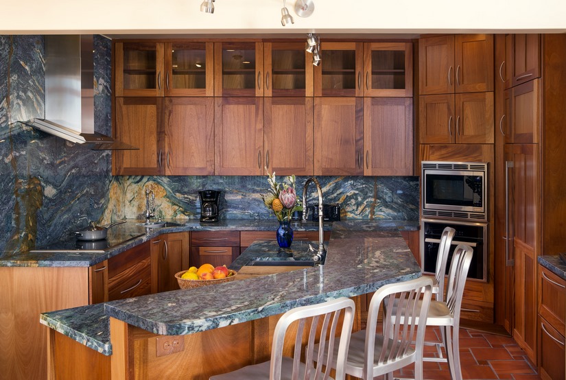 The Van Gogh granite and African mahogany cabinets vibrantly transform this ocean-side kitchen.